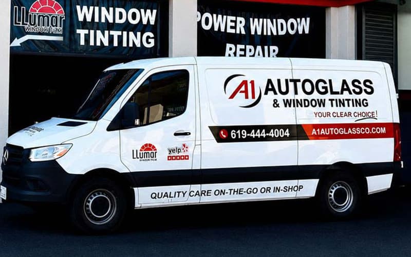 Technician replacing windshield on-site San Diego